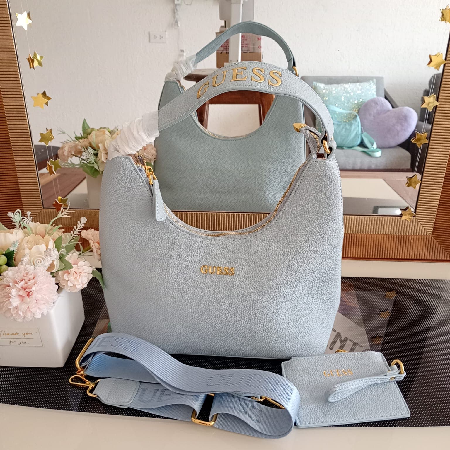 Bolsa de hombro Guess azul claro con correa y monedero a juego
